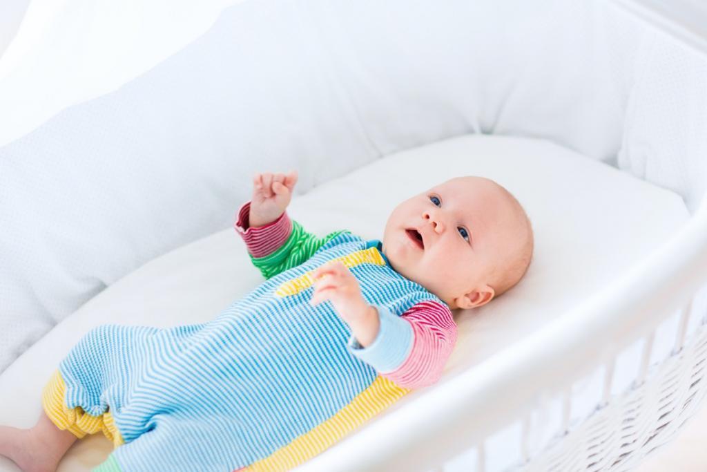 Here's When Your Baby Is Officially Too Big For The Bassinet, & Ready For A Crib