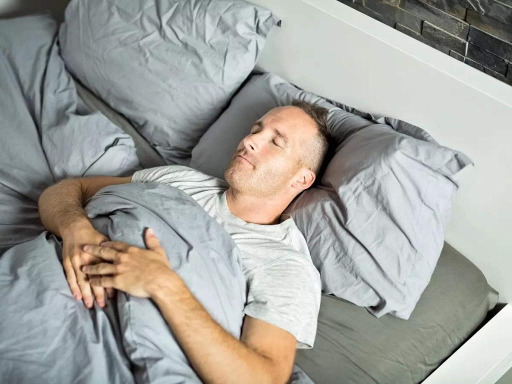 Why sleeping on your back is good for your health | The Times of India