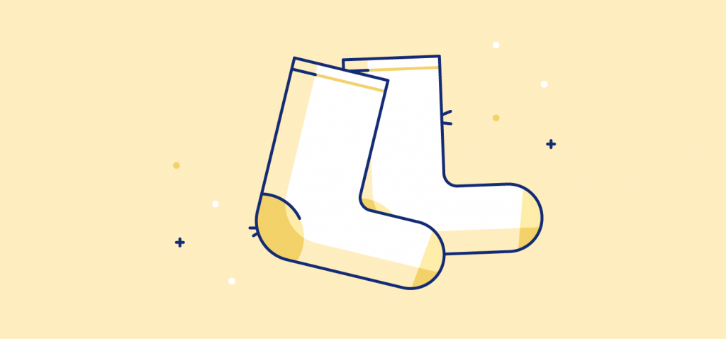A pair of socks. Illustration. Studies show that wearing warm socks can increase sleep efficiency by 7.6% and lower awakenings by 7.5 times.