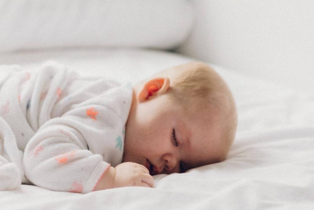 Should I roll my baby back over if she rolls onto her stomach in her sleep? | Stuff.co.nz